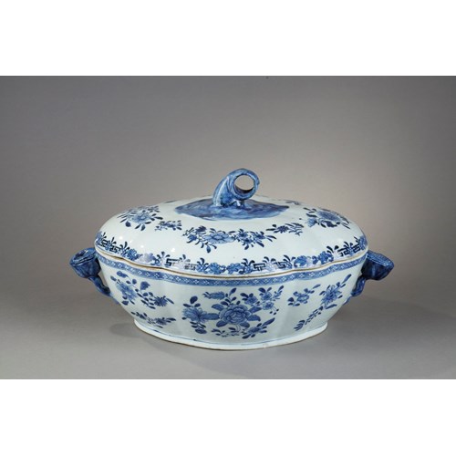 Tureen and its cover in blue white porcelain from a European orfevrerie model - flowers shaped handles